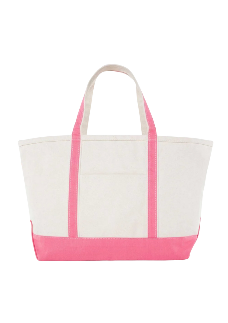 A canvas boat tote with a navy blue base and white upper part, featuring two handles and a front exterior pocket.