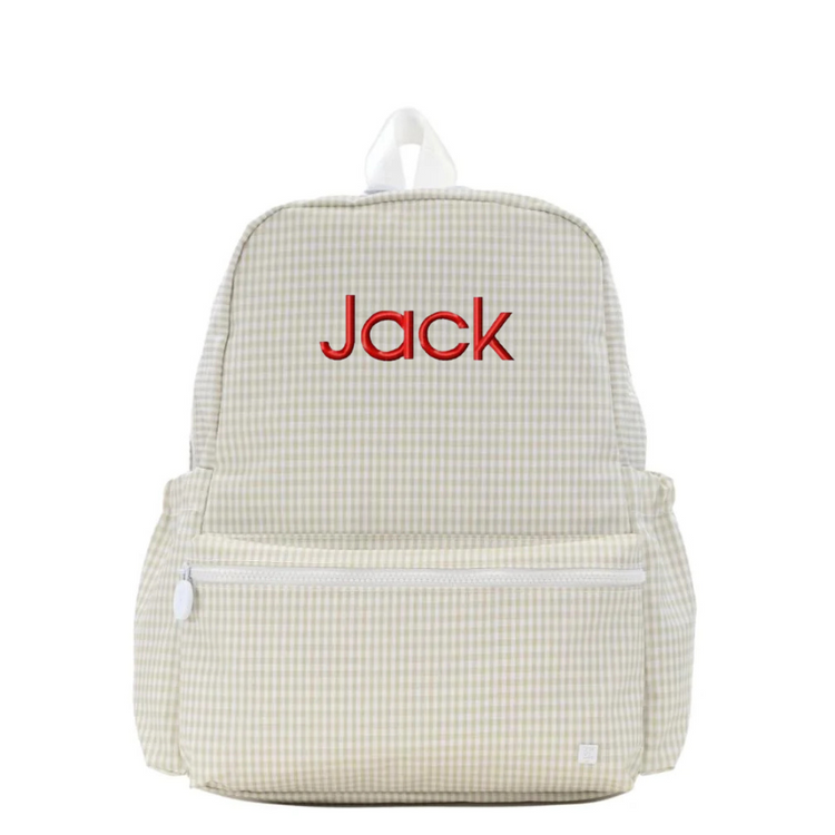 Beige checkered backpack with 'Jack' embroidered on a white background