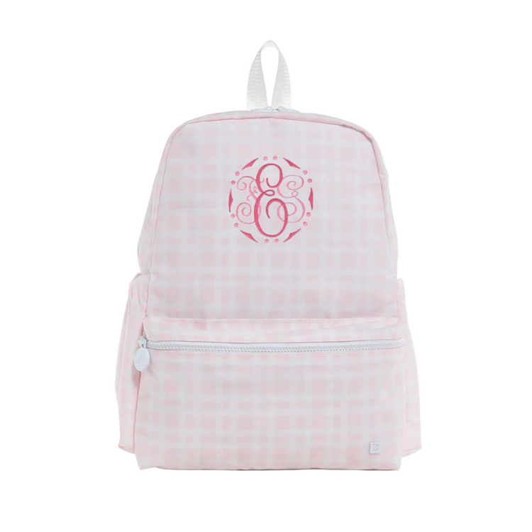 Pink checkered backpack with a monogram on a white background