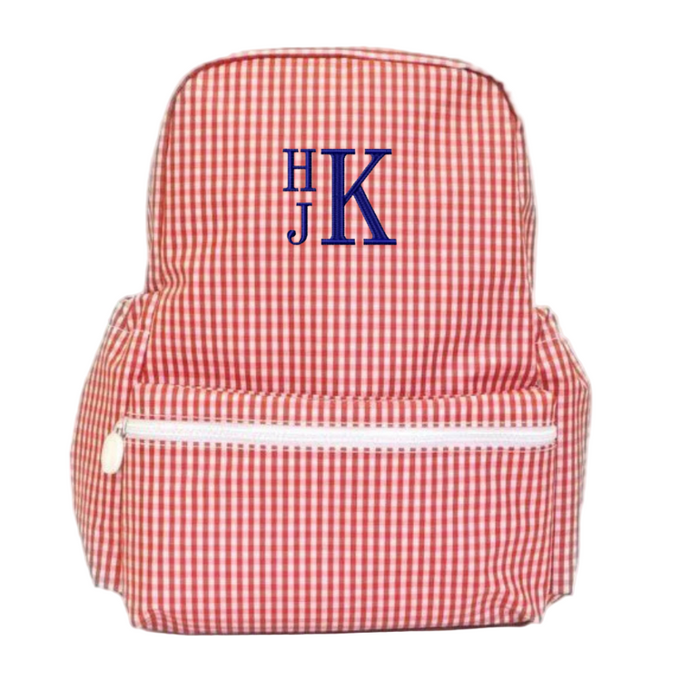 Red and white checkered backpack with blue monogram on a white background