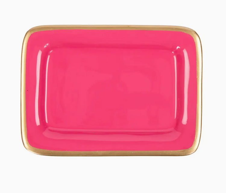 Pink rectangular plate with gold rim on a white background
