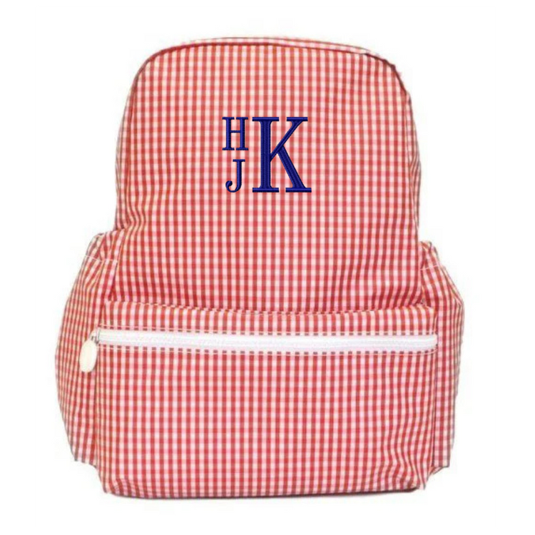Red and white checkered backpack with blue monogram on a white background