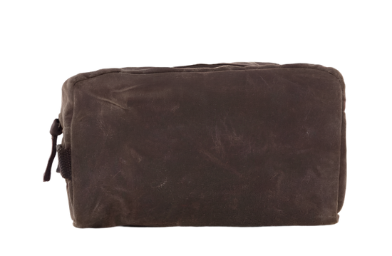 A waxed canvas travel kit in olive green with a top zip closure and side handle.