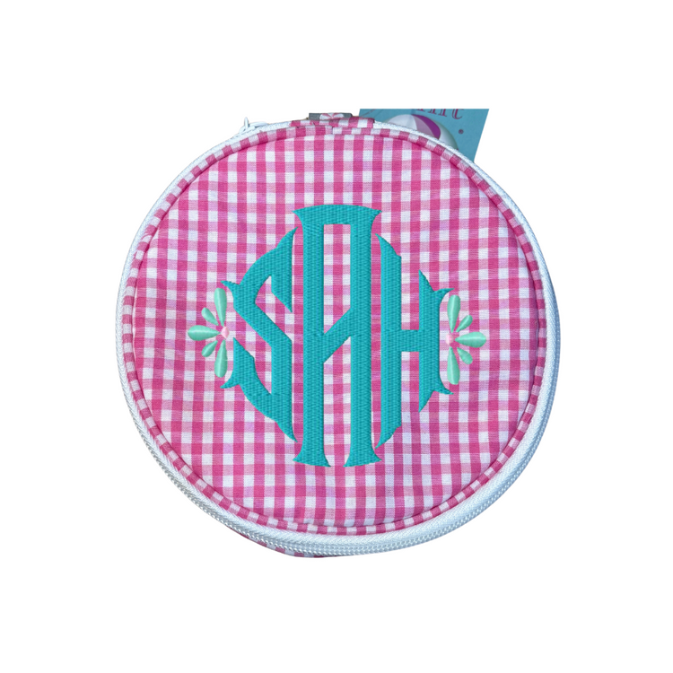 Round pouch with pink gingham pattern and teal monogram on a white background