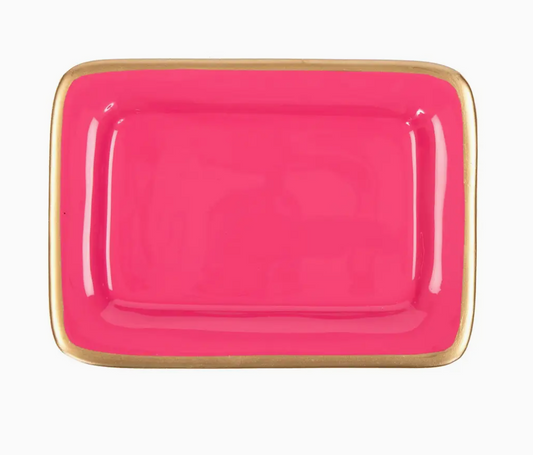 Pink rectangular plate with gold rim on a white background