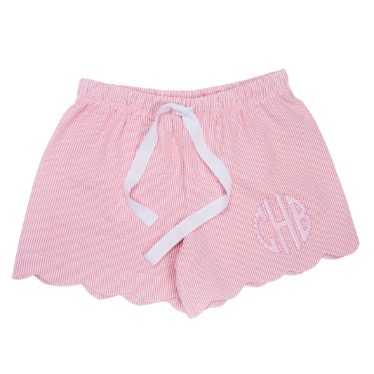 A pair of women's seersucker scallop lounge shorts in blue with a white drawstring waistband, displayed against a white background.