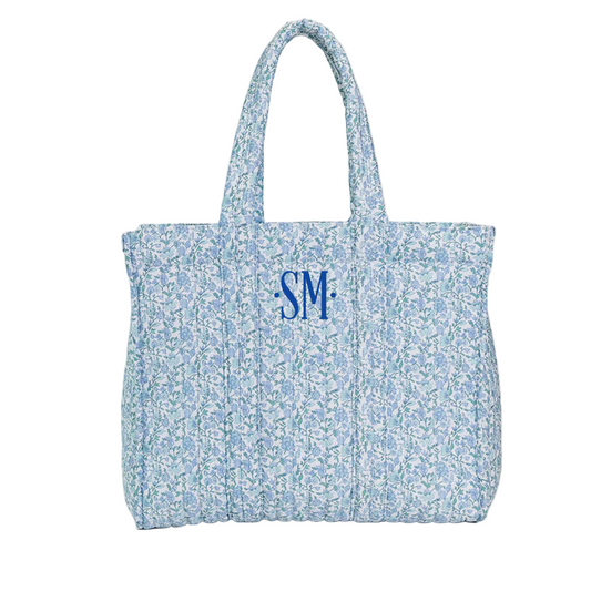 Floral patterned tote bag with 'SM' monogram on a white background